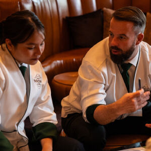 A man and a woman talking while sit