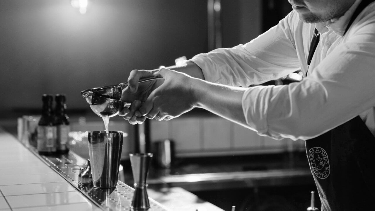 Close up of a man making a coktail