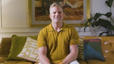 close up of a man in a yellow shirt