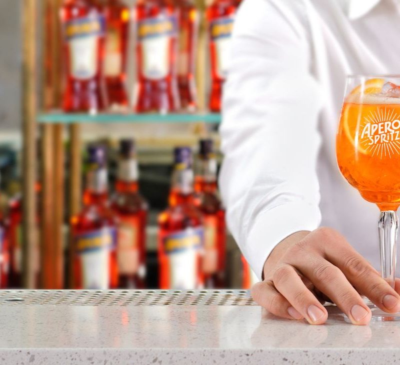 Man holding an Aperol glass