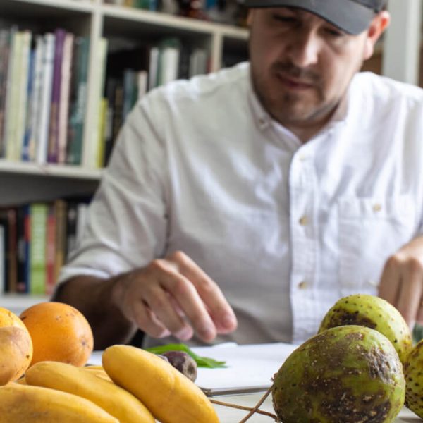 A man select fruits on a table