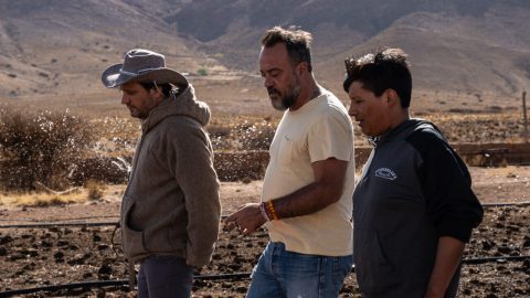 3 men walking in a arid place