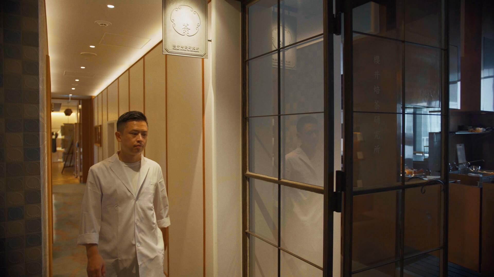 Man walking in a restaurant corridor