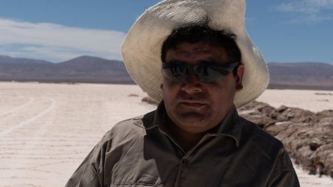 A person wearing a hat and sunglasses